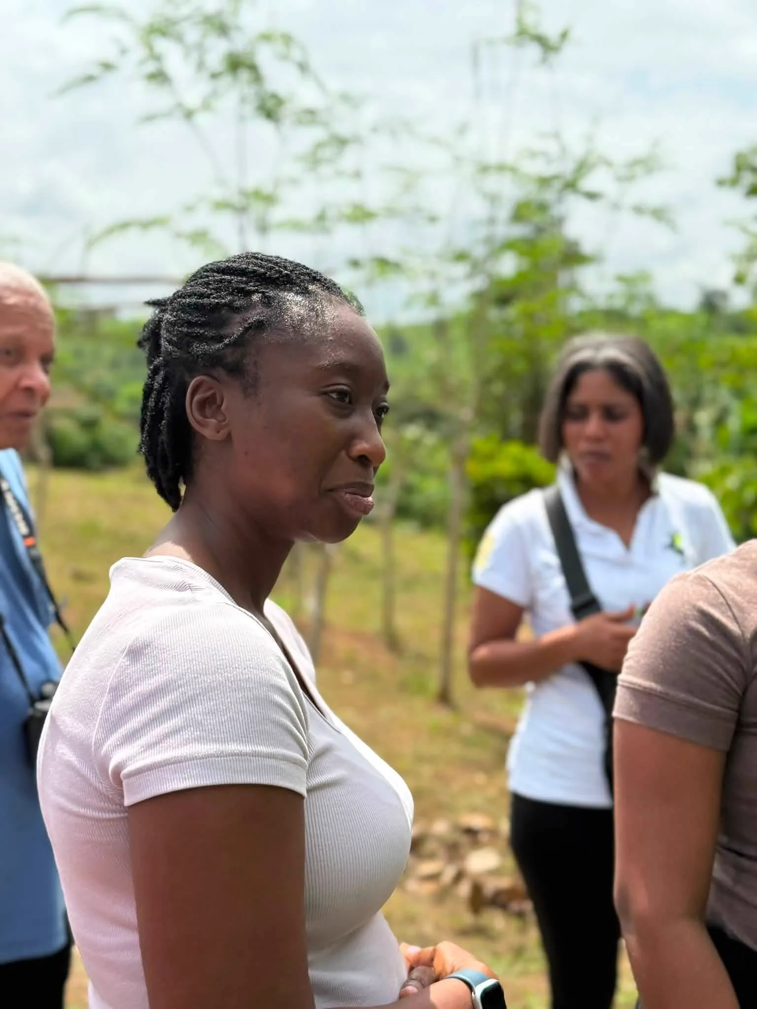 Visitors walking a farm trail at Adoko Farms